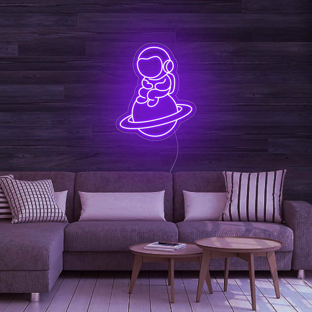 Astronaut Sitting On Planet Neon Sign