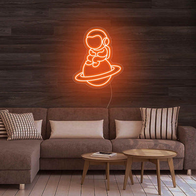 Astronaut Sitting On Planet Neon Sign