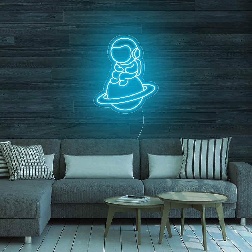 Astronaut Sitting On Planet Neon Sign